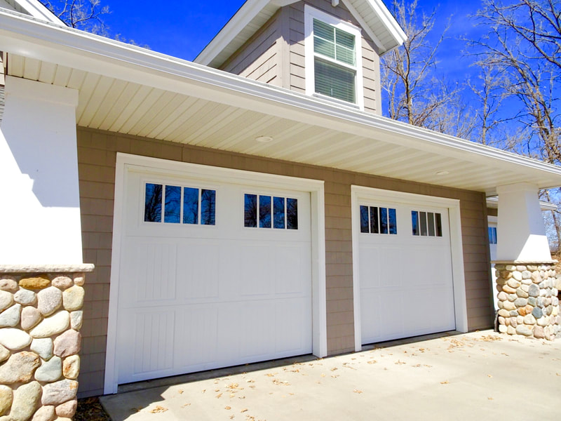 Amarr Classica in White with Tuscany Panels and Thames Windows (Insulated Glass).  Installed by Augusta Garage Door in St. Augusta, MN.