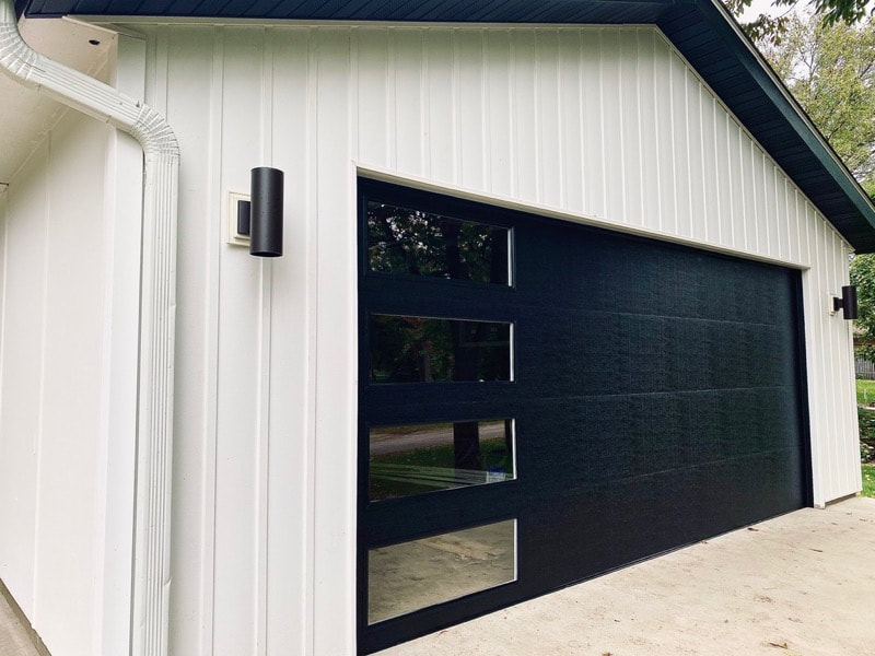 Wayne Dalton Garage Door Model 8300 in Black with Contemporary Panels and Vertical Clear Lites.  Installed by Augusta Garage Door in Avon, MN.