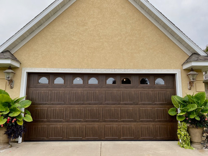 Wayne Dalton Garage Door Model 8500 in Mission Oak with Sonoma Panels and Cathedral Windows.  Installed by Augusta Garage Door in St. Cloud, MN.