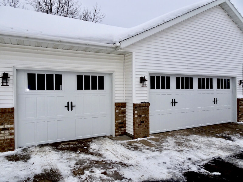 Amarr Classica Garage Doors in White with Northampton Panels and Thames Windows.  Installed by Augusta Garage Door in St. Cloud, MN.