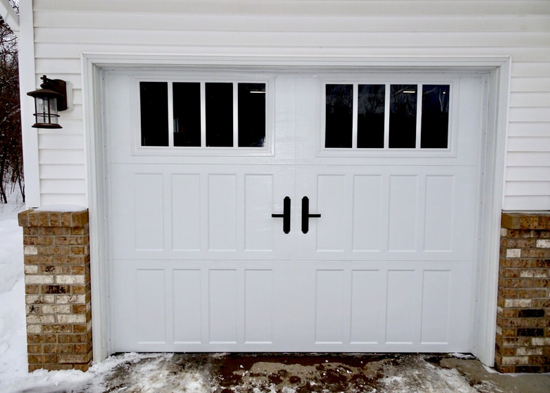 Amarr Classica Garage Door in White with Northampton Panels and Thames Windows.  Installed by Augusta Garage Door in St. Cloud, MN.