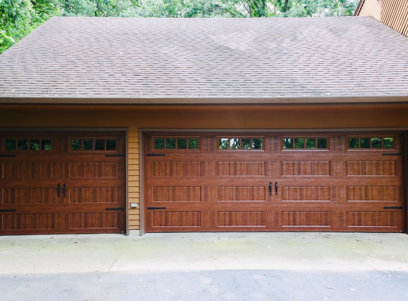 Amarr Hillcrest 3000 Garage Door in Walnut with Long Panel Bead Board and Thames Windows.  Installed by Augusta Garage Door in St. Cloud, MN.