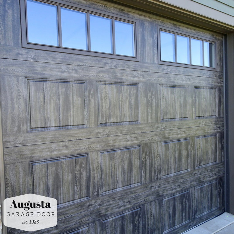 Clopay Gallery Series in Oak Slate with REC14 Windows.  Installed by Augusta Garage Door in Cold Spring, MN.
