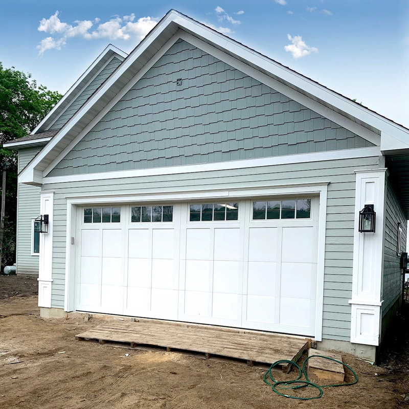 Wayne Dalton Model 6600  in White with Somerset Panels and Stockbridge Insulated Glass.  Installed by Augusta Garage Door in Annandale, MN.